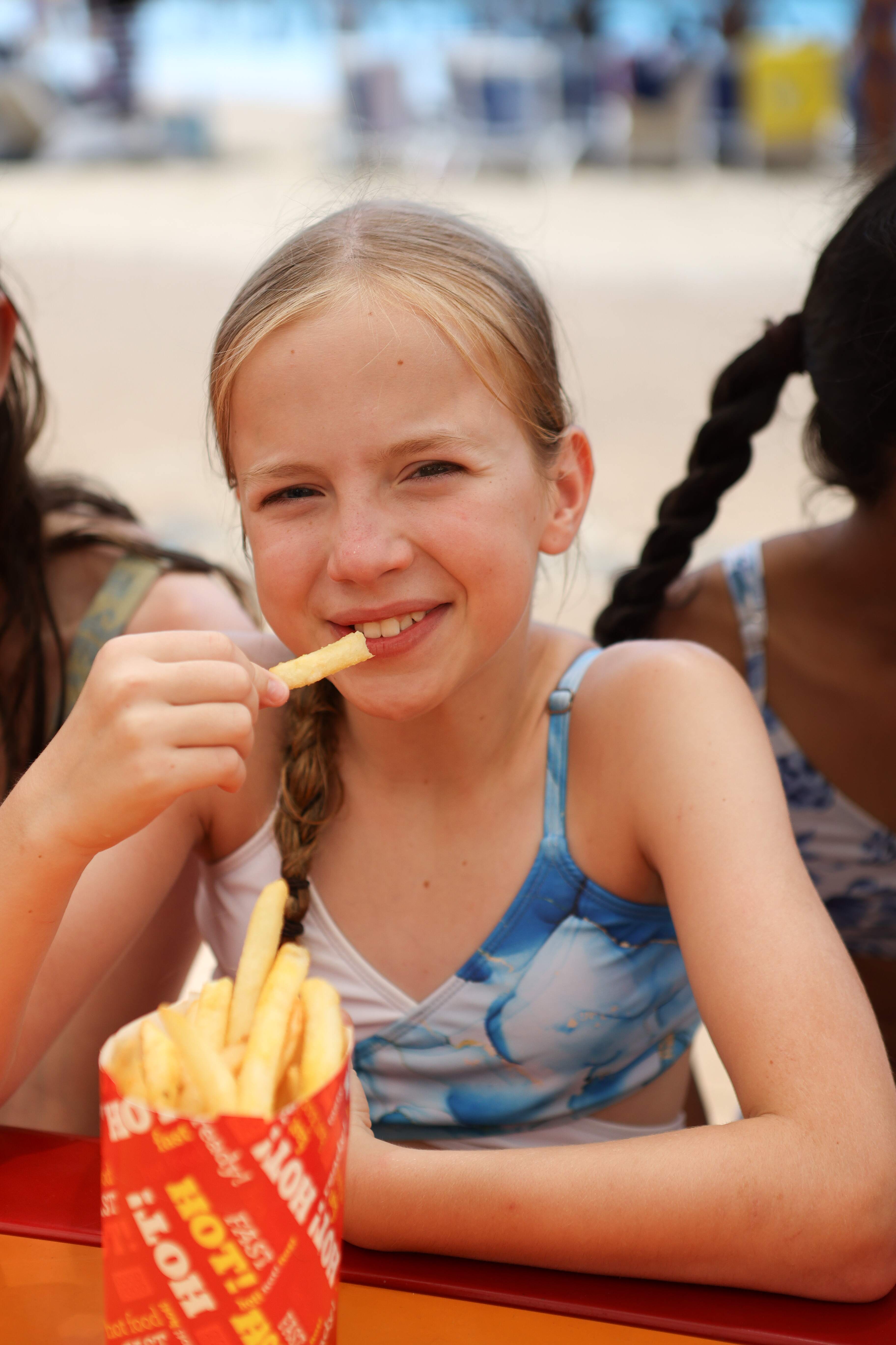 Girl eating chips combo meal